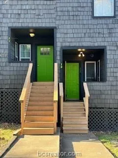 a view of a brick house with a large window
