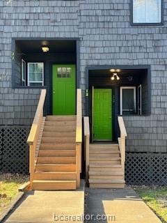 3802 College Main Street, Unit 12 Bryan, TX 77801 - Photo 1 of 11 a view of a brick house with a large window