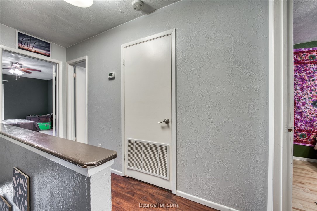 3802 College Main Street, Unit 12 Bryan, TX 77801 - Photo 11 of 11 a view of a hallway and an dining rom with furniture