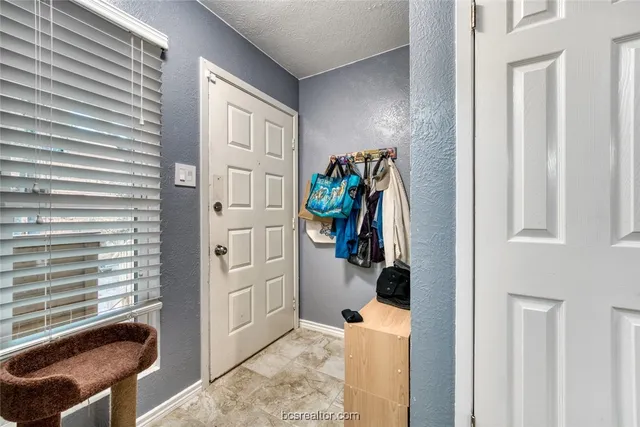 a view of a livingroom with furniture and closet