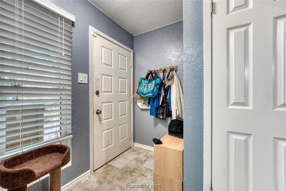 3802 College Main Street, Unit 12 Bryan, TX 77801 - Photo 8 of 11 a view of a livingroom with furniture and closet