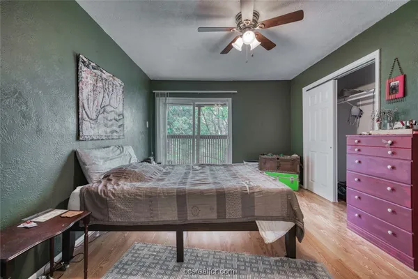 a bed room with a bed window and a table