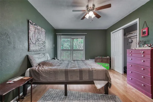 a bed room with a bed window and a table