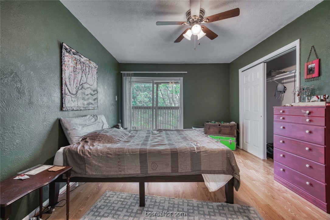 3802 College Main Street, Unit 12 Bryan, TX 77801 - Photo 9 of 11 a bed room with a bed window and a table