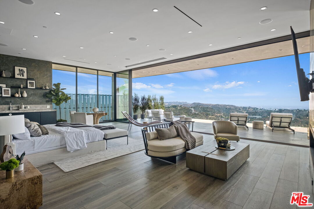 2304 Donella Circle Los Angeles, CA 90077 - Photo 11 of 24 a living room with furniture and a large window