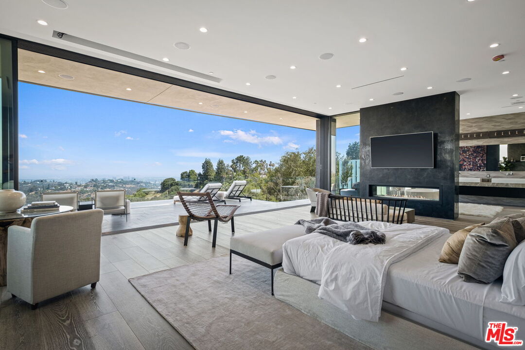 2304 Donella Circle Los Angeles, CA 90077 - Photo 12 of 24 a living room with furniture and a flat screen tv