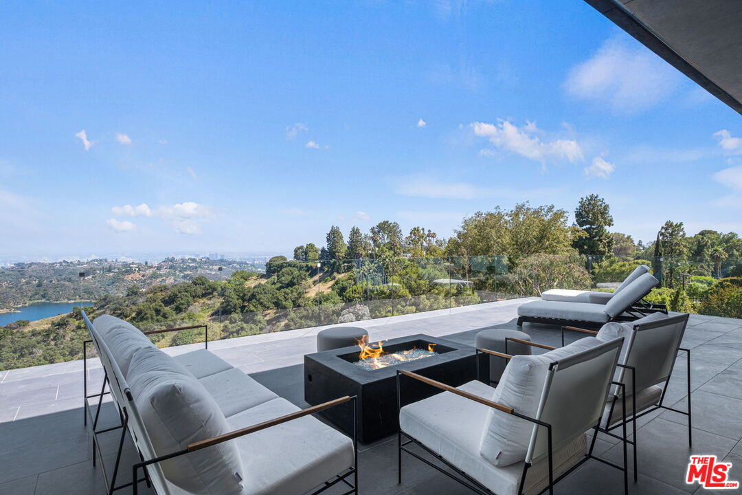 2304 Donella Circle Los Angeles, CA 90077 - Photo 14 of 24 a view of a terrace with furniture and a garden