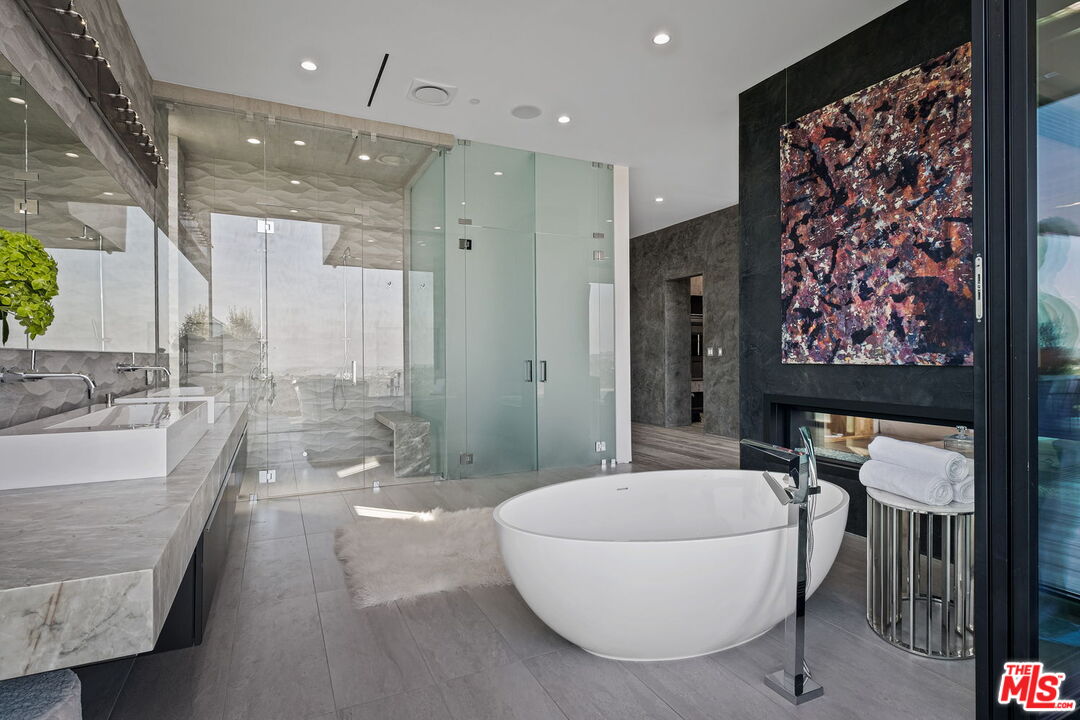 2304 Donella Circle Los Angeles, CA 90077 - Photo 16 of 24 a bathroom with a bathtub and a shower