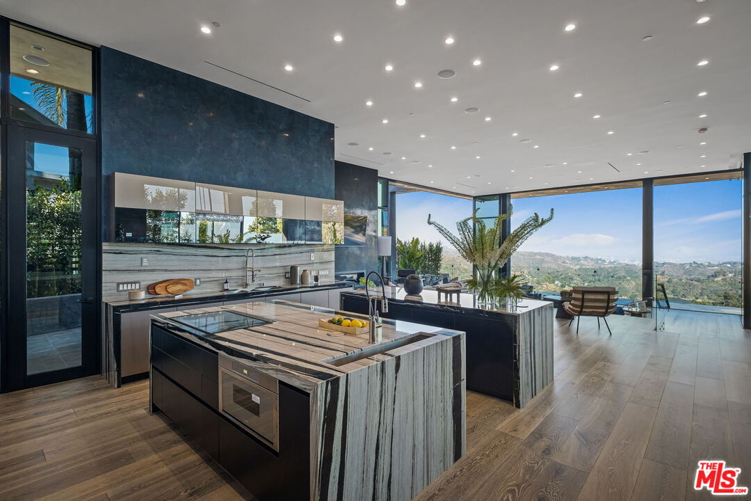 2304 Donella Circle Los Angeles, CA 90077 - Photo 3 of 24 a kitchen with a stove and wooden floor