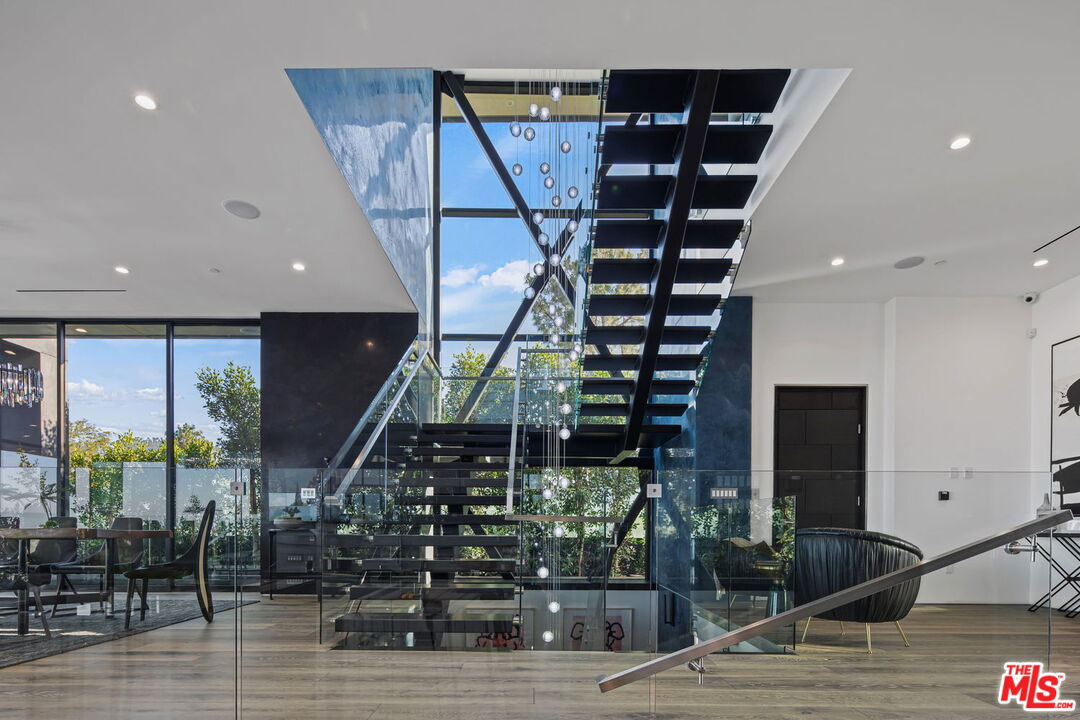 2304 Donella Circle Los Angeles, CA 90077 - Photo 5 of 24 a view of entryway and hall with wooden floor