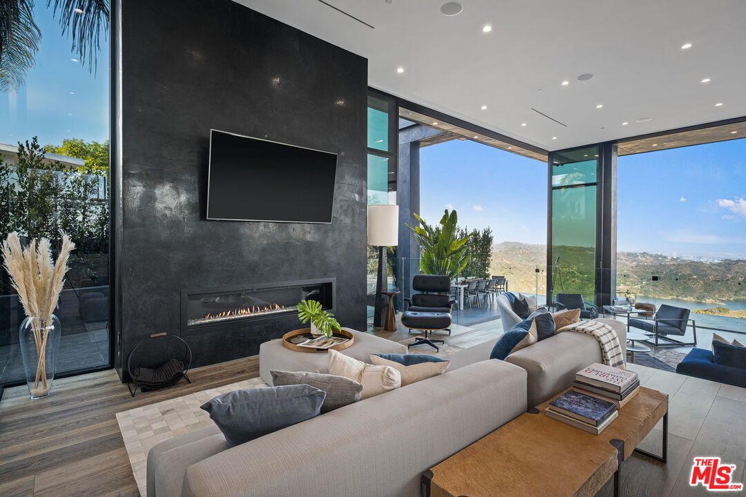 2304 Donella Circle Los Angeles, CA 90077 - Photo 6 of 24 a living room with furniture and a flat screen tv
