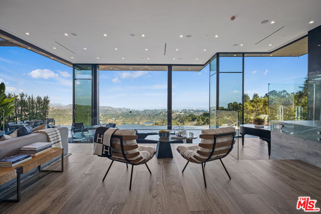2304 Donella Circle Los Angeles, CA 90077 - Photo 7 of 24 a living room with furniture and a large window