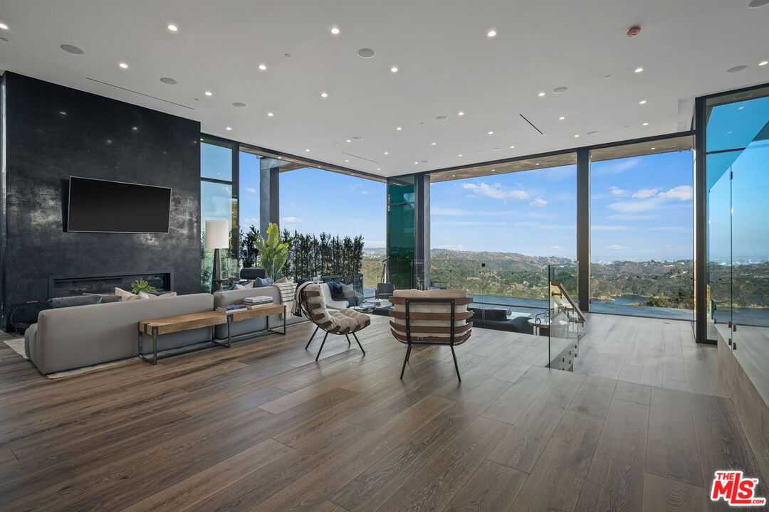 2304 Donella Circle Los Angeles, CA 90077 - Photo 8 of 24 a living room with furniture and a flat screen tv
