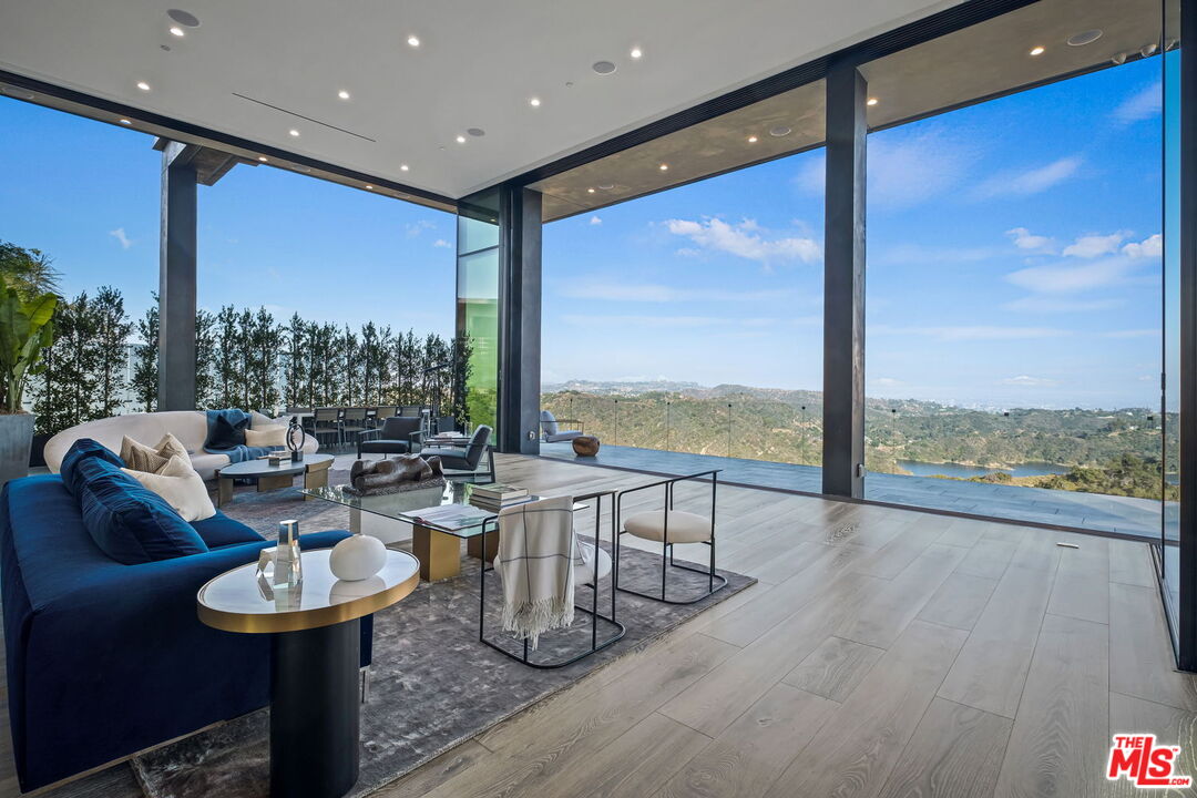 2304 Donella Circle Los Angeles, CA 90077 - Photo 9 of 24 a living room with couches and a large window with garden view