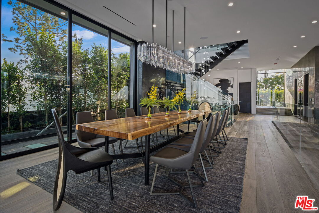2304 Donella Circle Los Angeles, CA 90077 - Photo 10 of 24 a dining room with furniture a chandelier and wooden floor
