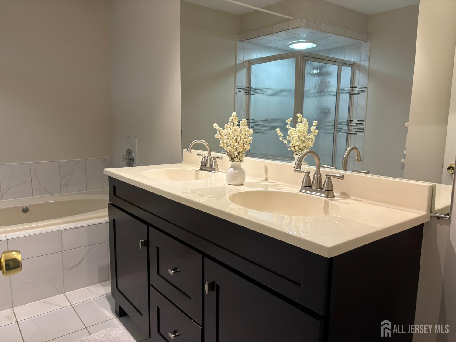 285 Greenfield Road Bridgewater, NJ 08807 - Photo 15 of 26 a bathroom with a sink and a bathtub