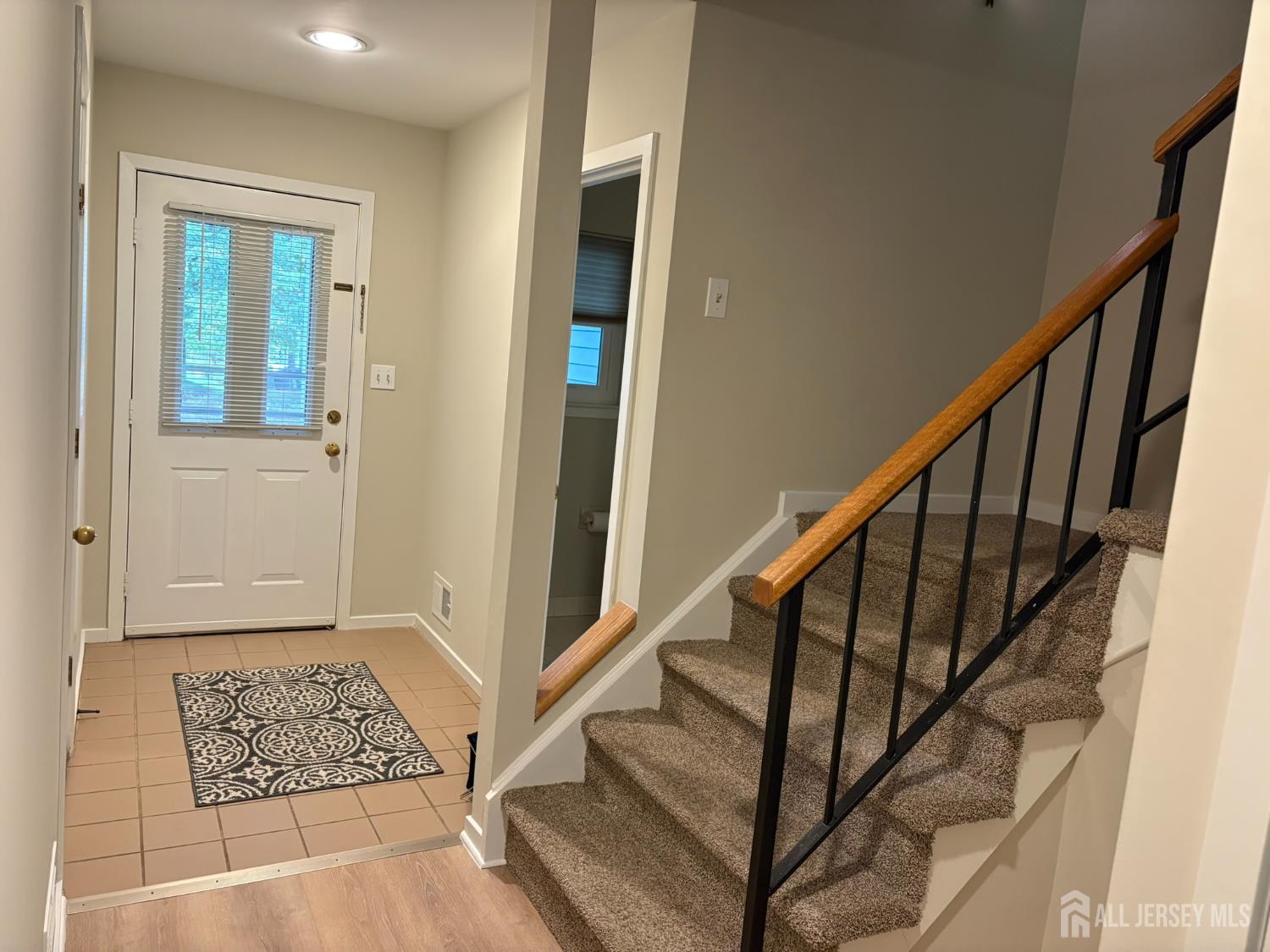 285 Greenfield Road Bridgewater, NJ 08807 - Photo 2 of 26 a view of an entryway with wooden floor and stairs