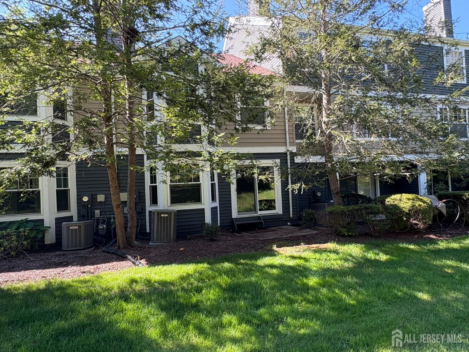 285 Greenfield Road Bridgewater, NJ 08807 - Photo 25 of 26 a view of a house with backyard garden and sitting area