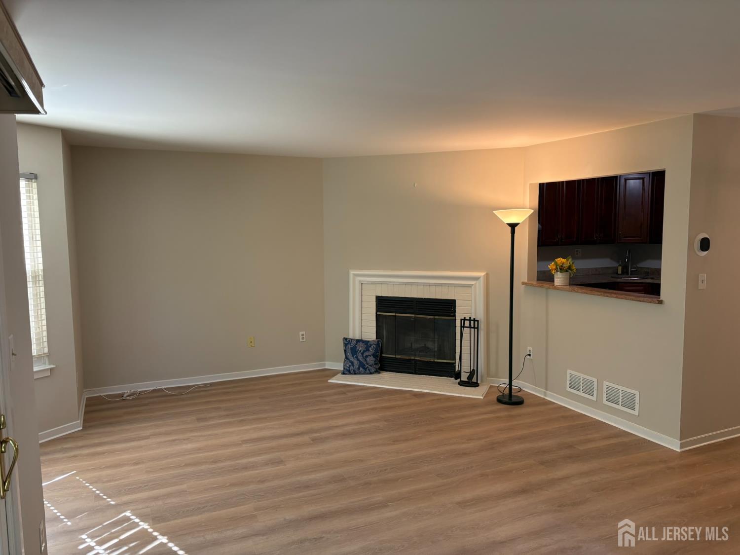 285 Greenfield Road Bridgewater, NJ 08807 - Photo 6 of 26 a view of livingroom with a flat screen tv and a fireplace
