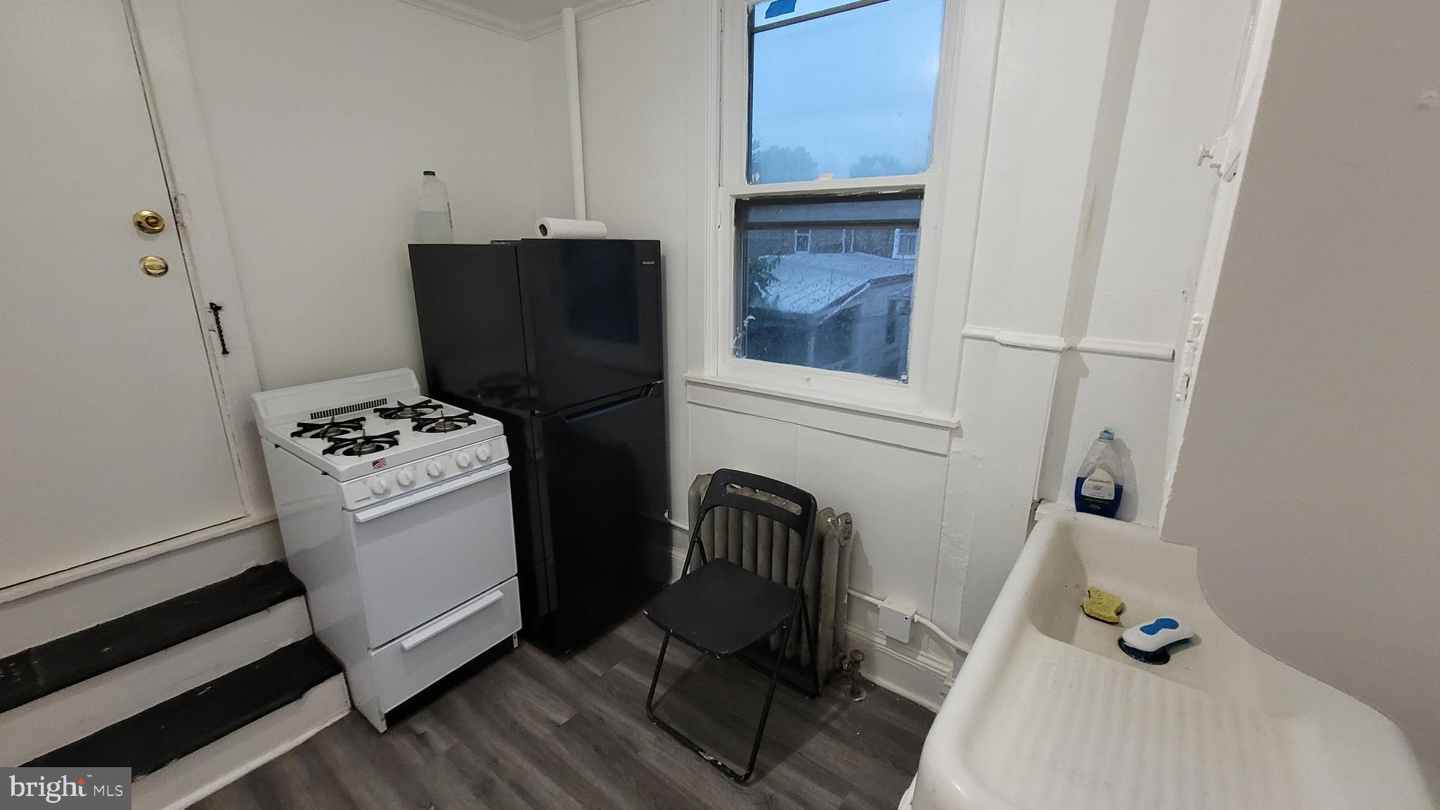 324 Spring Street, Unit 3 Reading, PA 19601 - Photo 12 of 27 a view of kitchen with refrigerator and stove