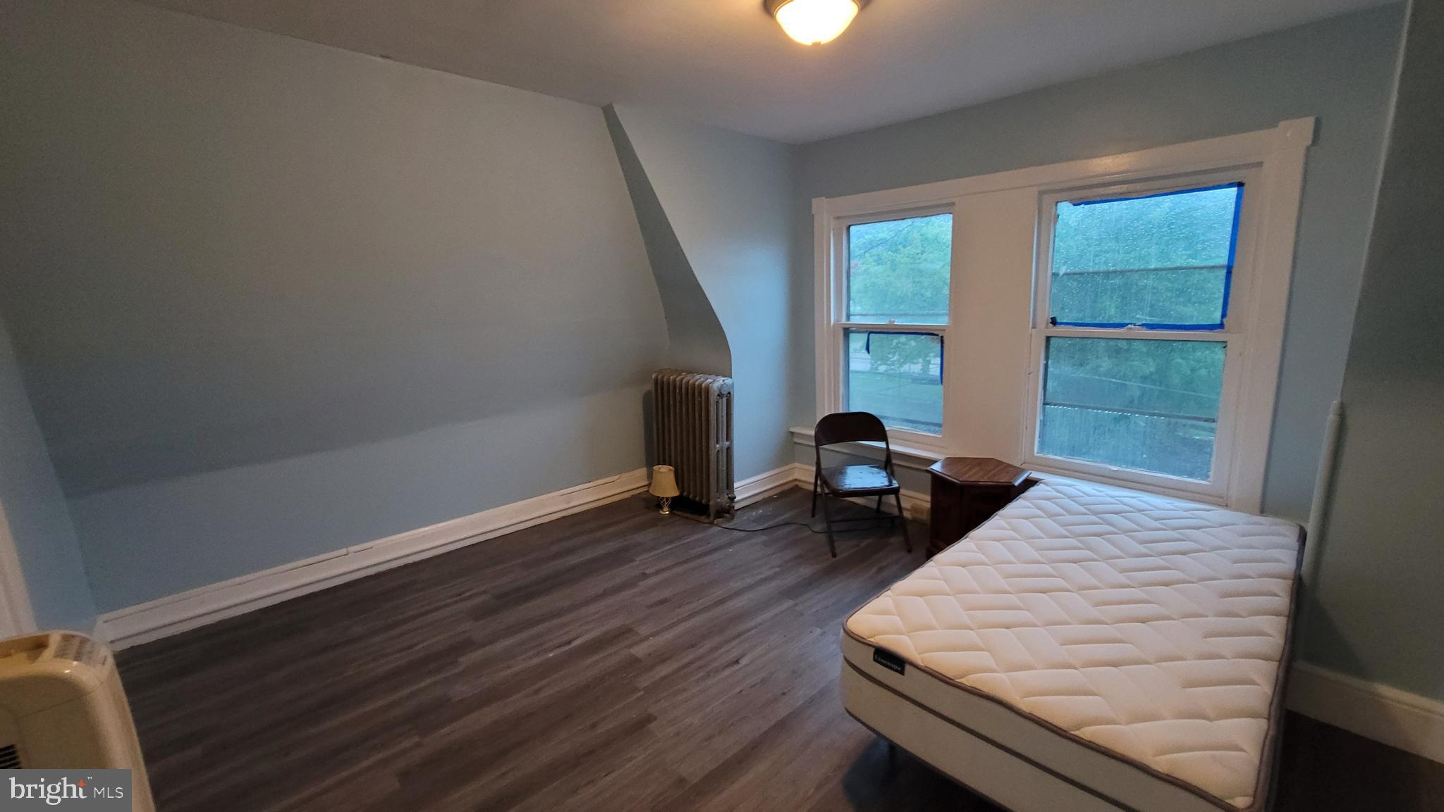 324 Spring Street, Unit 3 Reading, PA 19601 - Photo 21 of 27 a bed room with a bed and a window