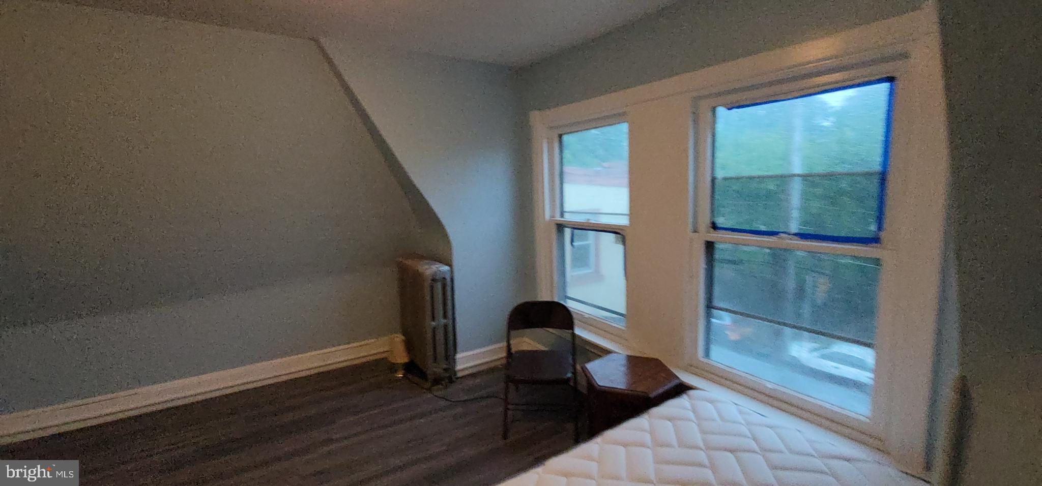 324 Spring Street, Unit 3 Reading, PA 19601 - Photo 22 of 27 a view of a room with wooden floor and a rug