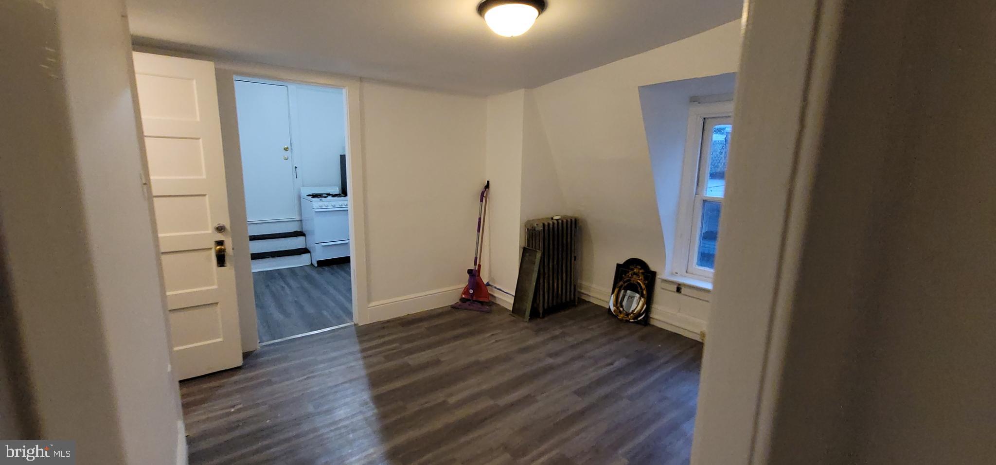 324 Spring Street, Unit 3 Reading, PA 19601 - Photo 26 of 27 a view of empty room with wooden floor