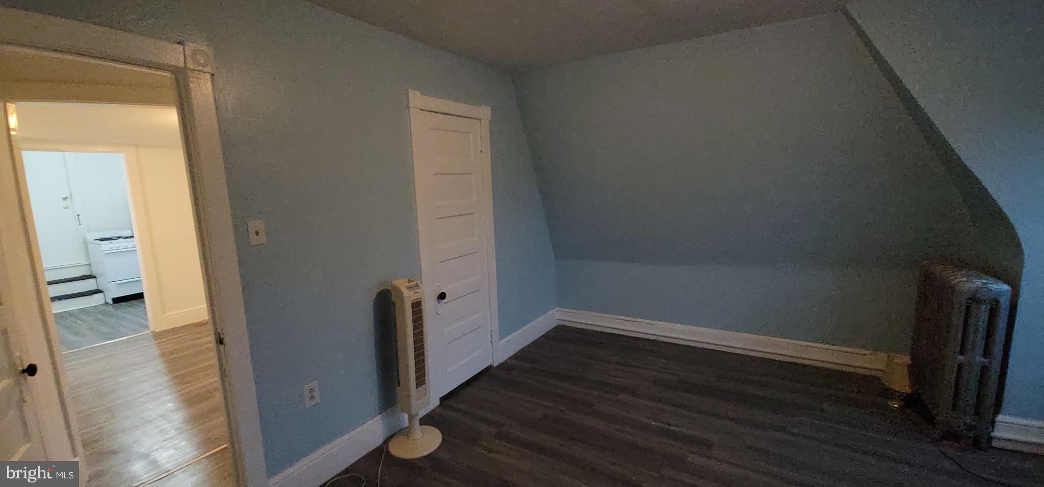 324 Spring Street, Unit 3 Reading, PA 19601 - Photo 27 of 27 an empty room and wooden floor