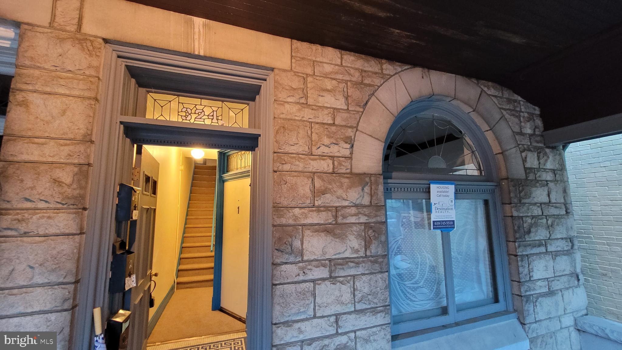 324 Spring Street, Unit 3 Reading, PA 19601 - Photo 7 of 27 a building with a sign on the wall