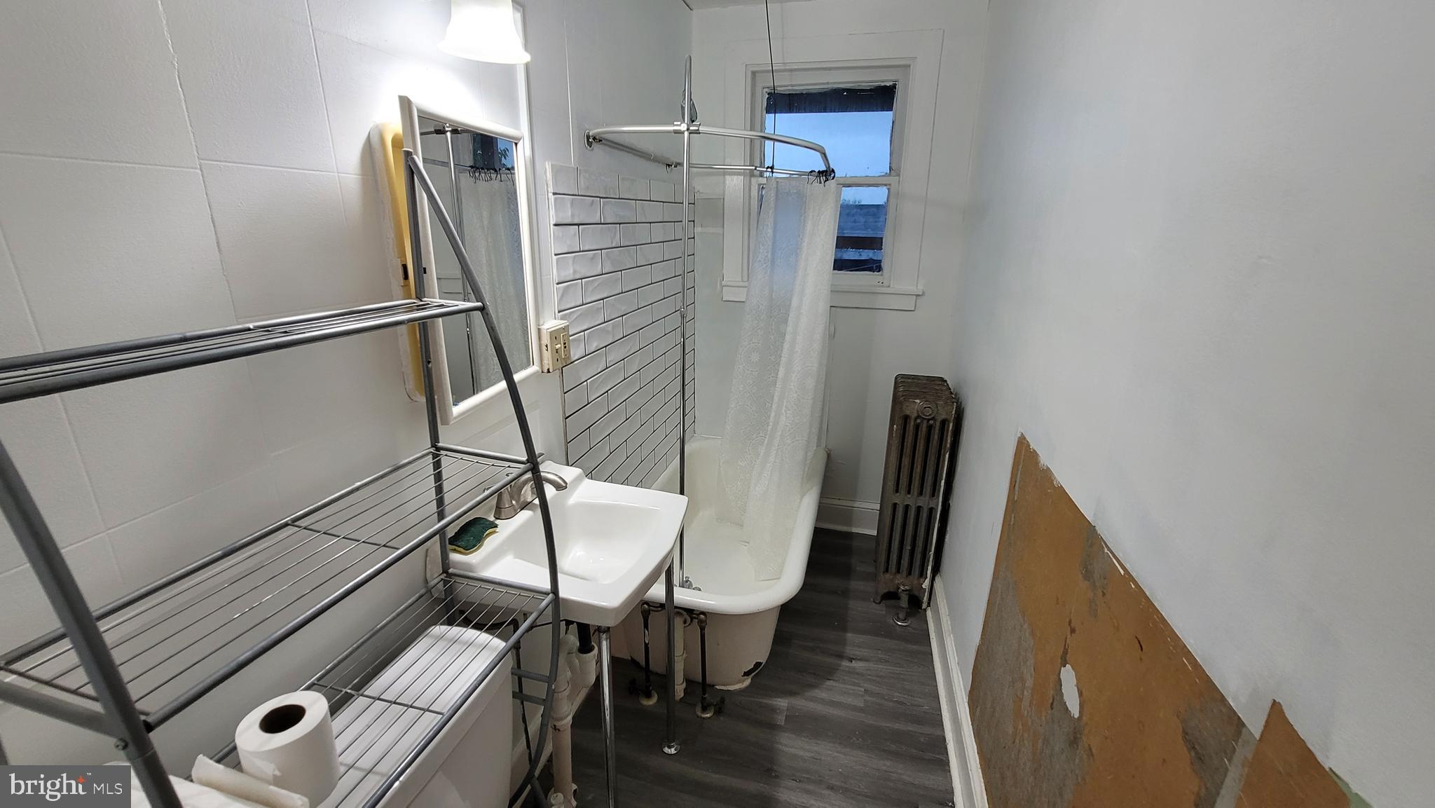 324 Spring Street, Unit 3 Reading, PA 19601 - Photo 9 of 27 a bathroom with a toilet and a shower