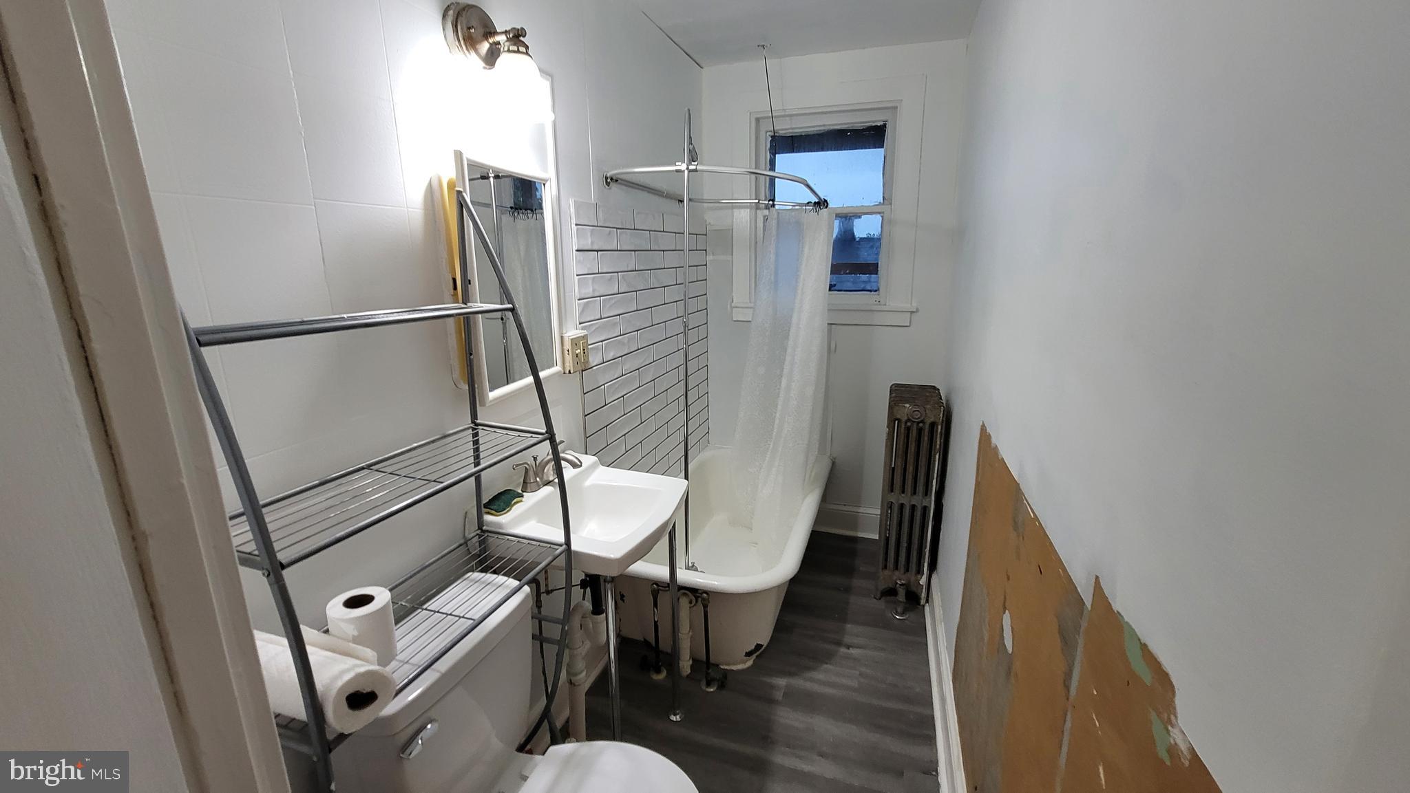 324 Spring Street, Unit 3 Reading, PA 19601 - Photo 10 of 27 a bathroom with a toilet and a sink
