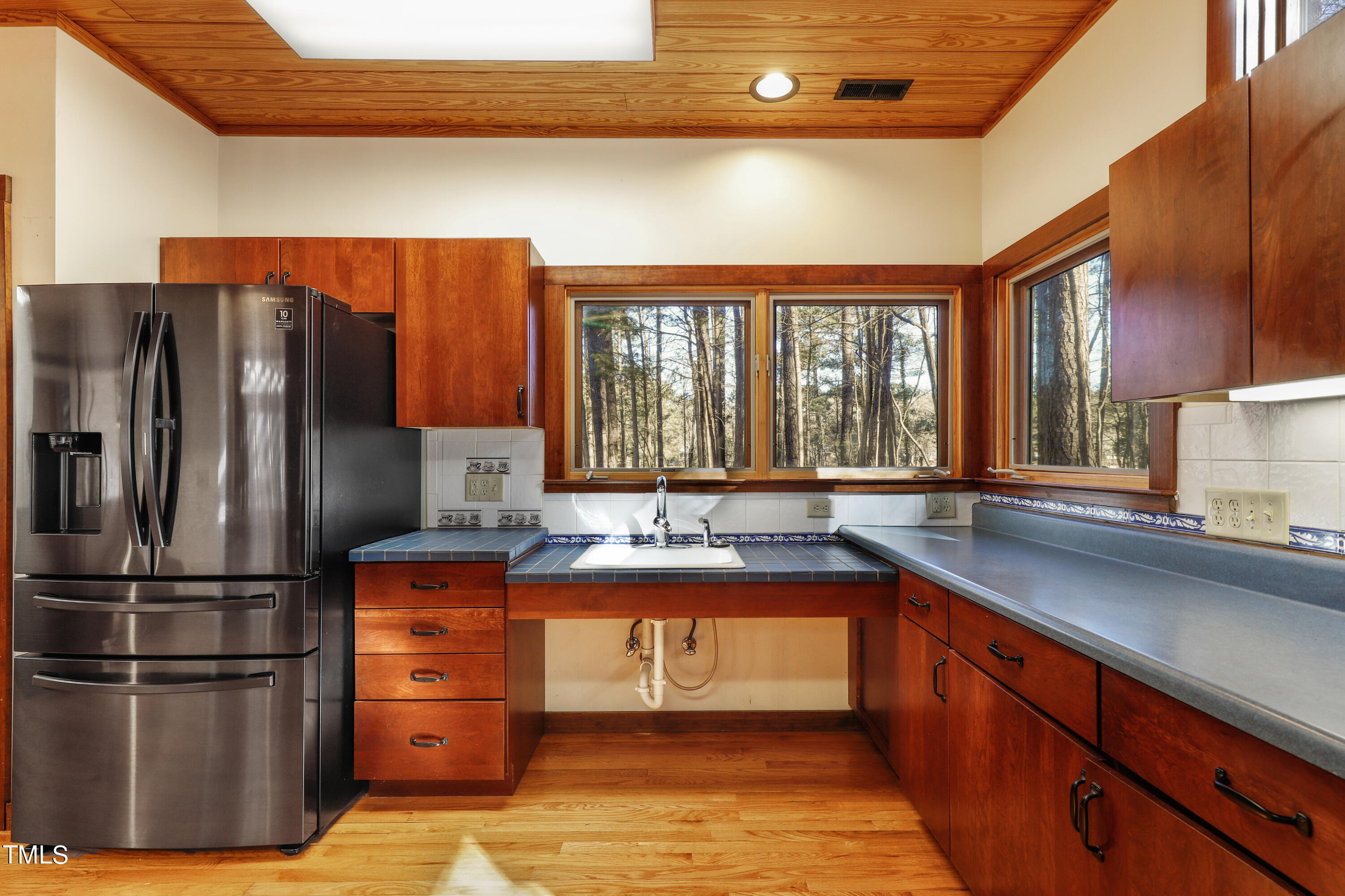 316 Clark Lake Road Durham, NC 27707 - Photo 14 of 65 a kitchen with stainless steel appliances granite countertop a refrigerator and a sink