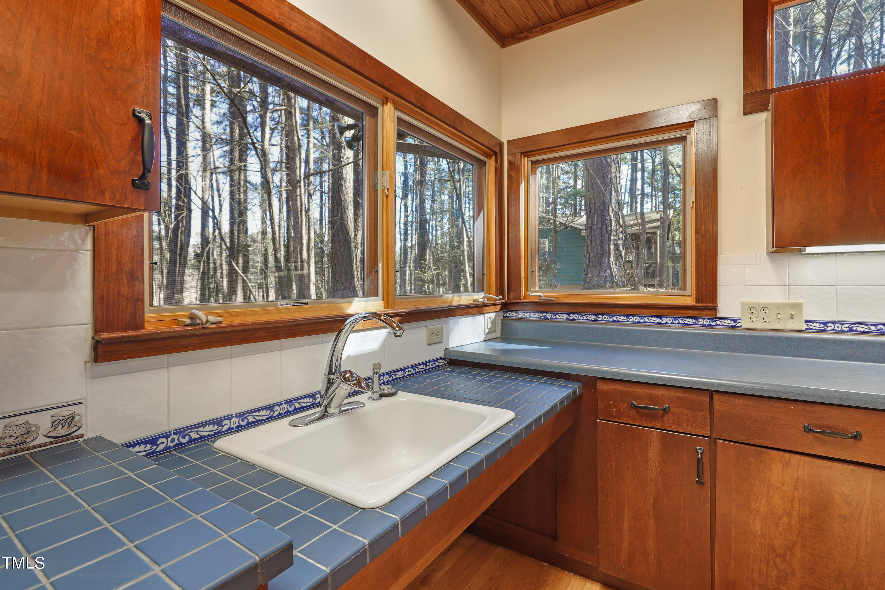 316 Clark Lake Road Durham, NC 27707 - Photo 15 of 65 a room with a large window and a sink