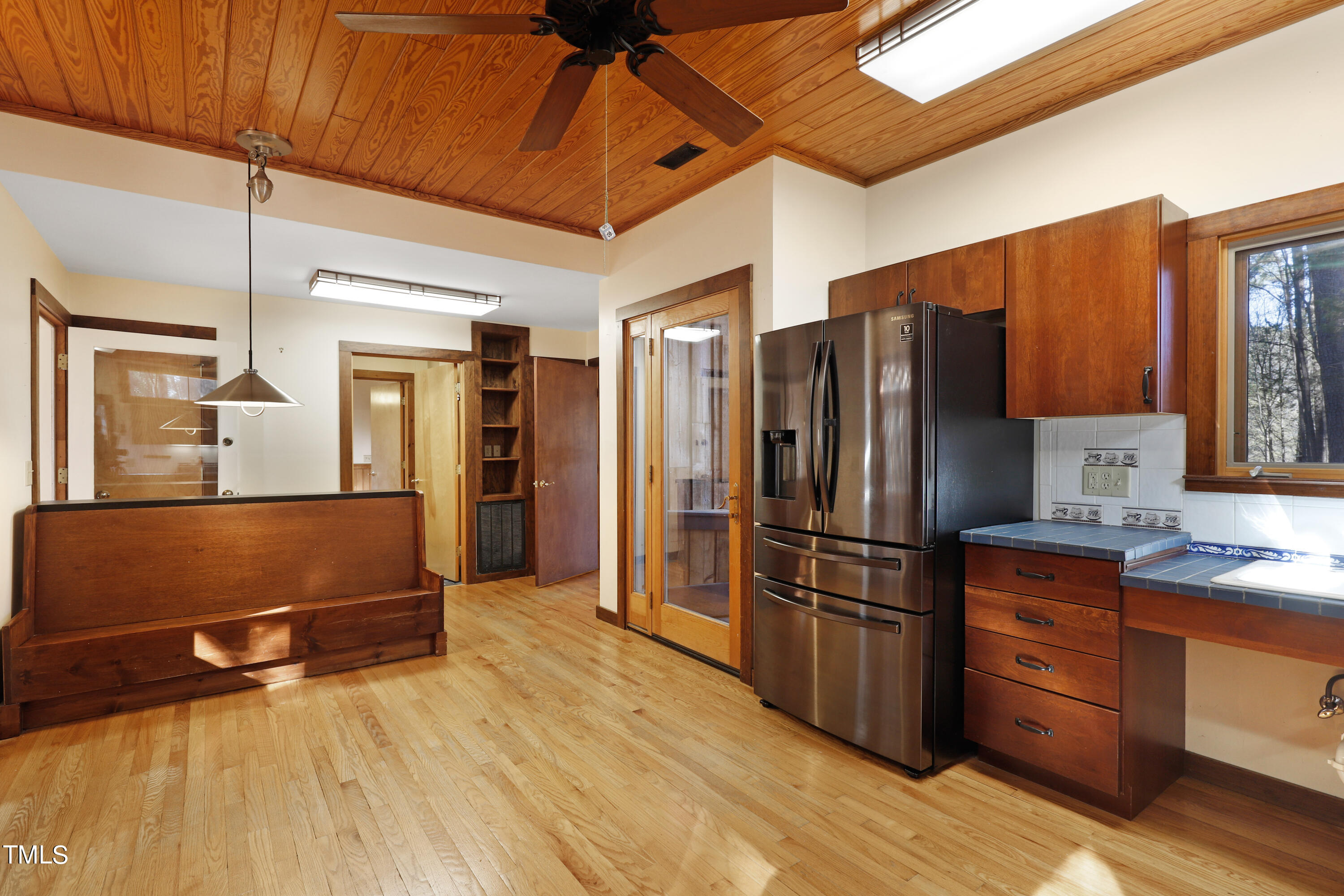 316 Clark Lake Road Durham, NC 27707 - Photo 17 of 65 a kitchen with stainless steel appliances granite countertop a refrigerator and a sink