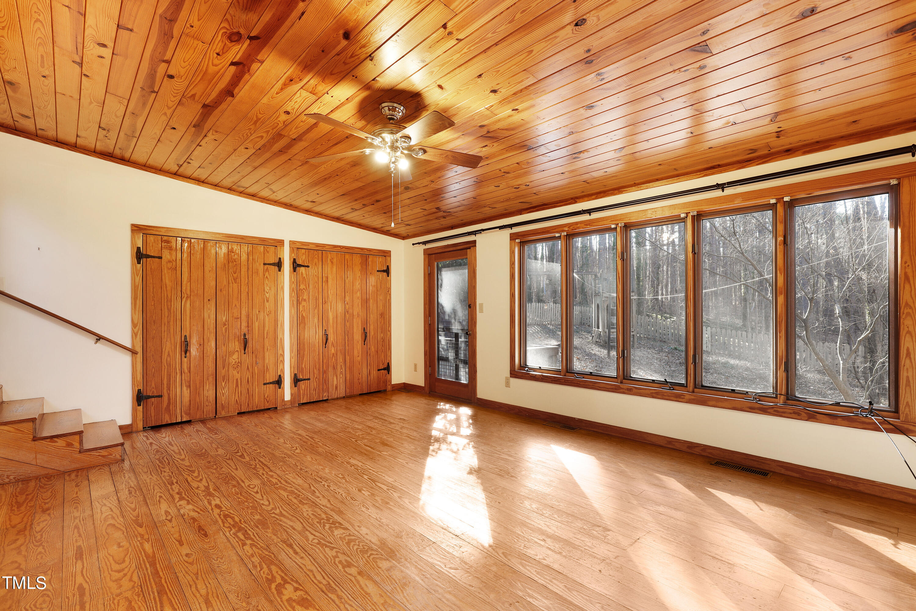 316 Clark Lake Road Durham, NC 27707 - Photo 33 of 65 a view of empty room with wooden floor and fan