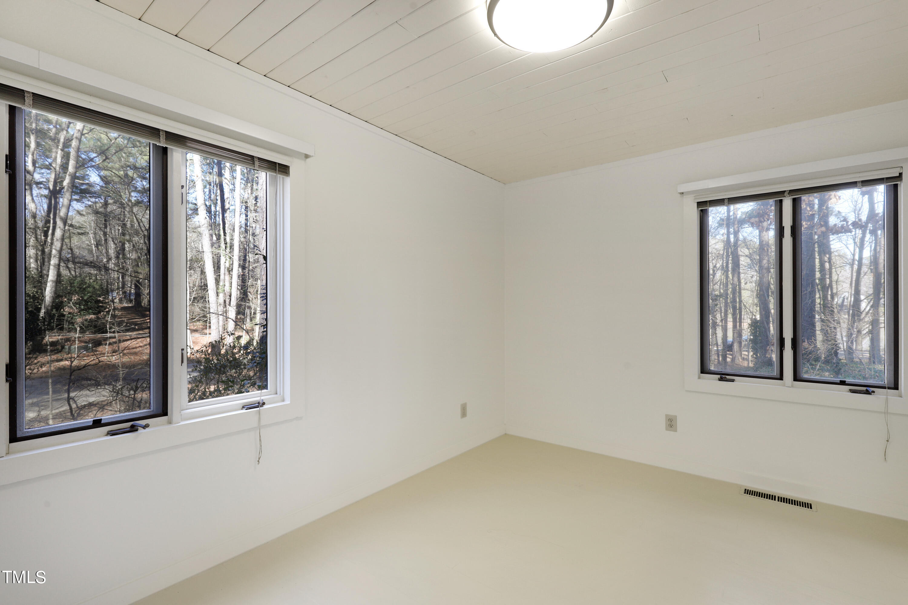 316 Clark Lake Road Durham, NC 27707 - Photo 38 of 65 a view of an empty room with a window