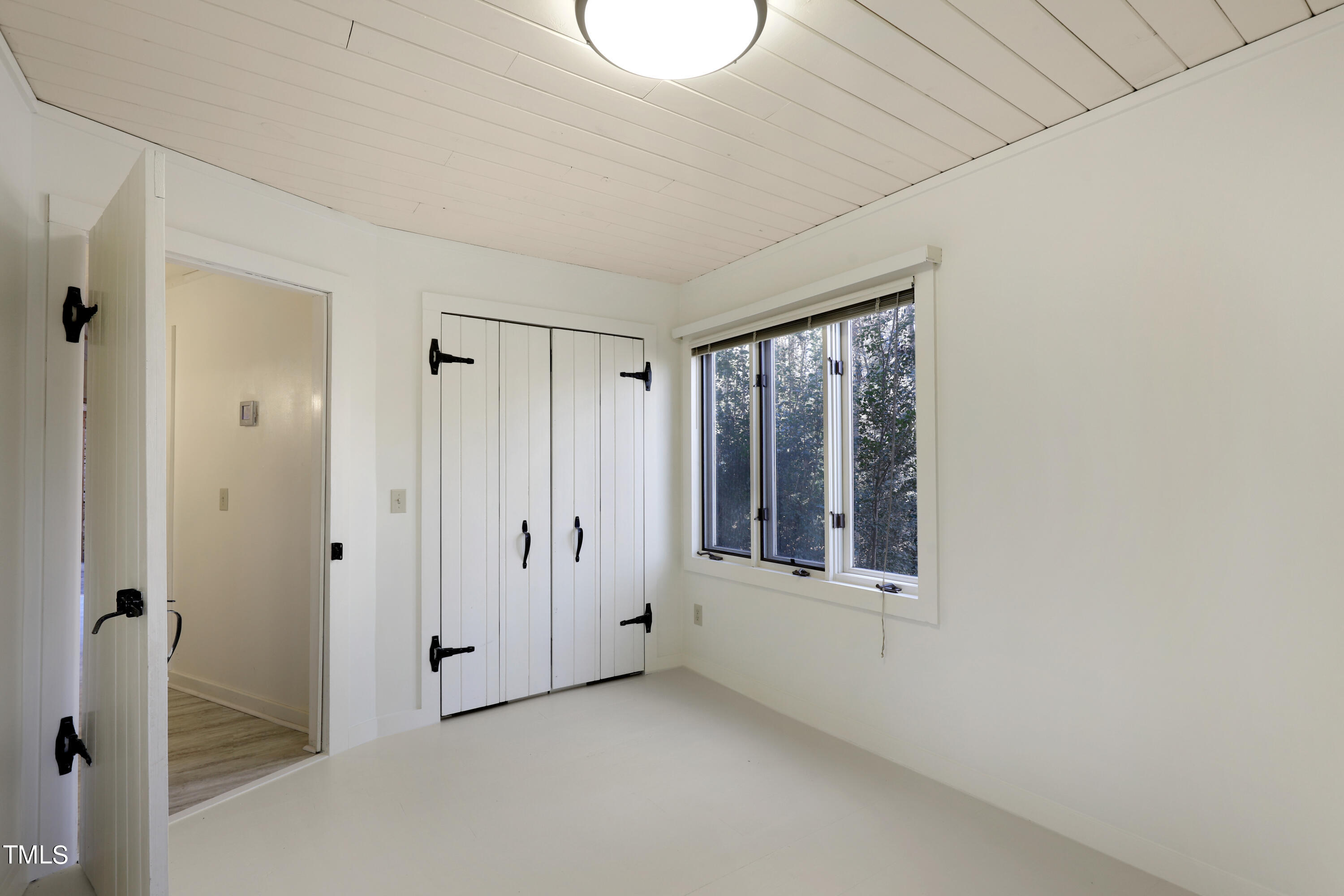 316 Clark Lake Road Durham, NC 27707 - Photo 39 of 65 a view of an empty room with a window