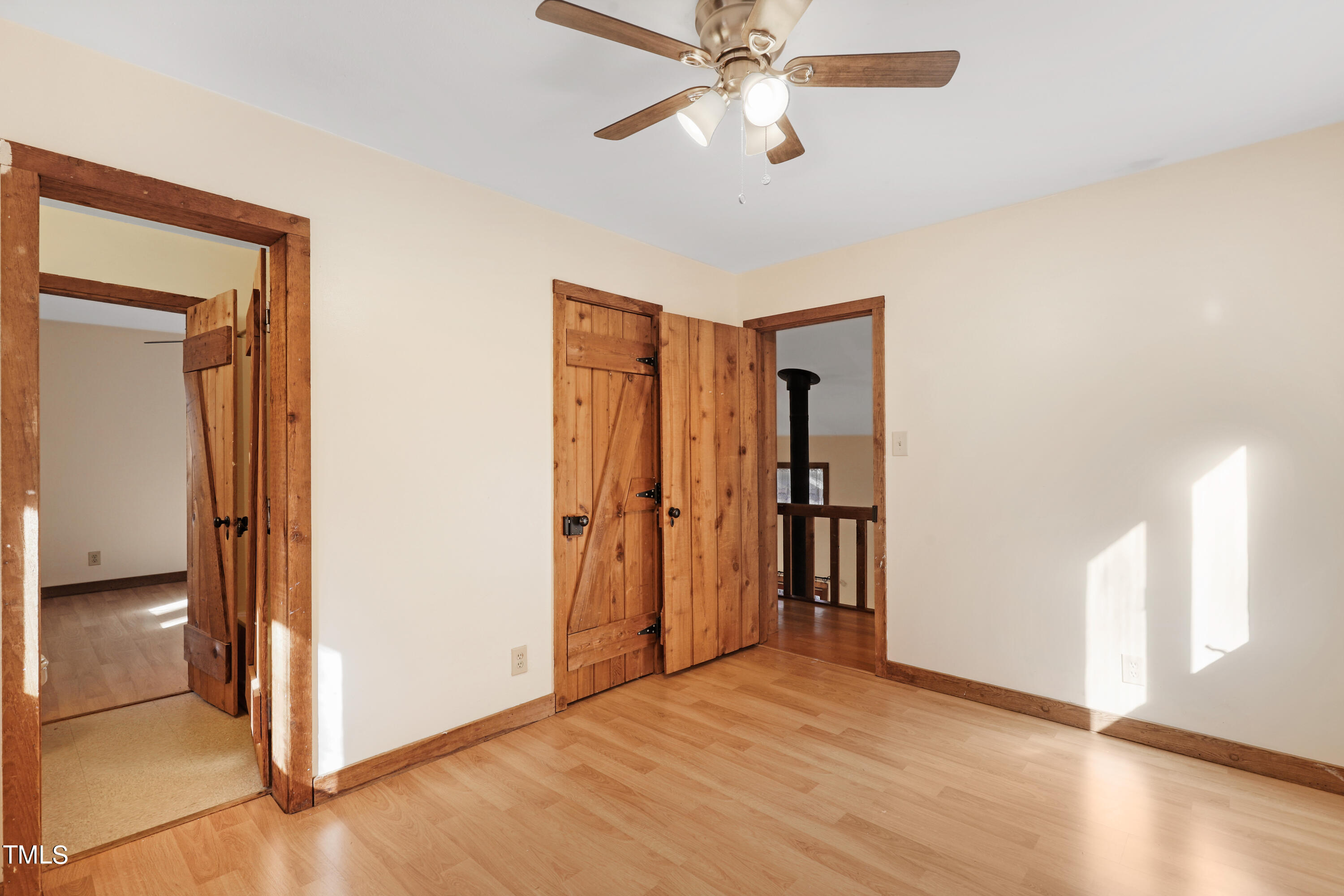 316 Clark Lake Road Durham, NC 27707 - Photo 45 of 65 a view of an empty room with window and wooden floor