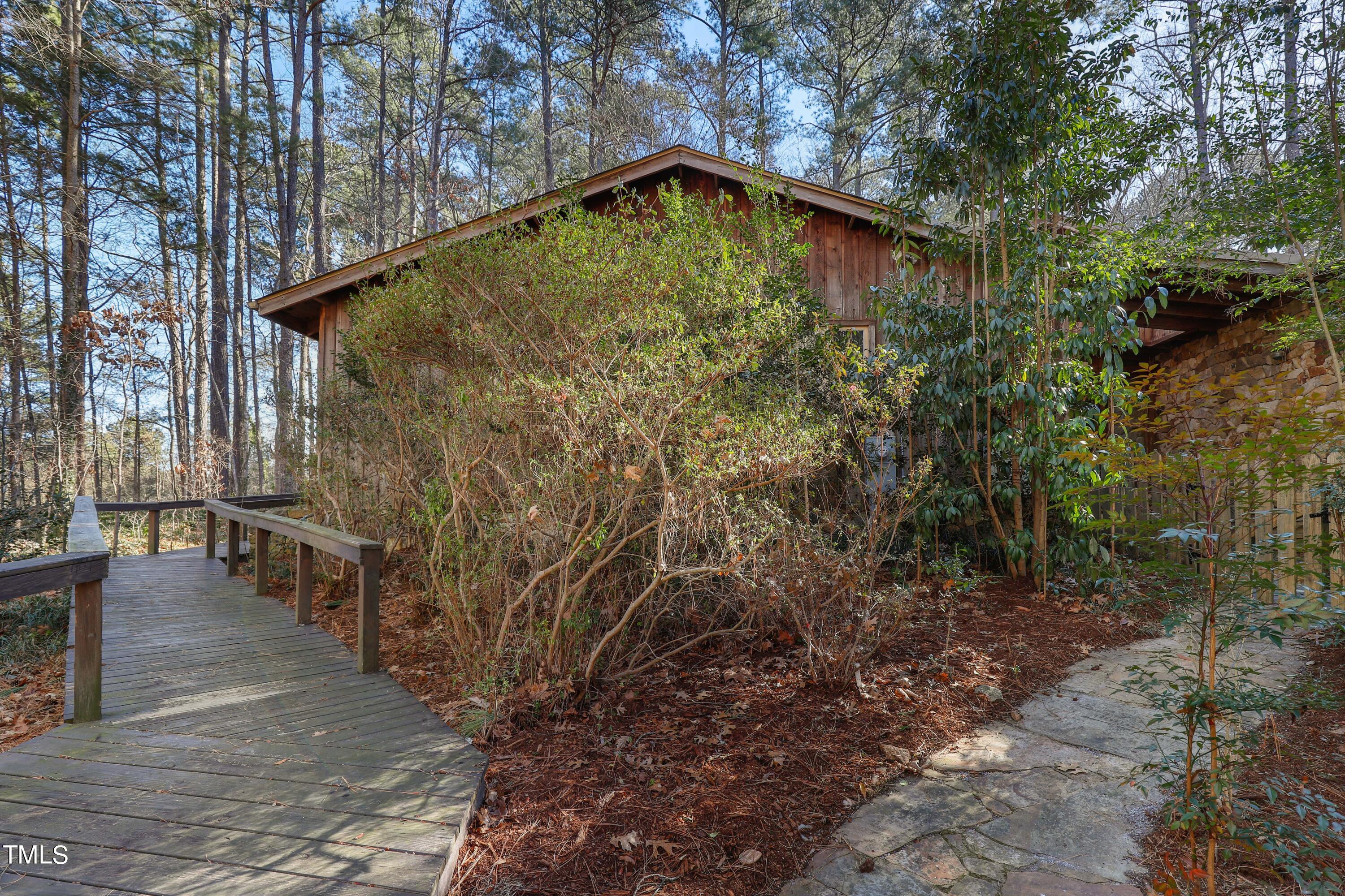 316 Clark Lake Road Durham, NC 27707 - Photo 60 of 65 a backyard of a house with lots of green space