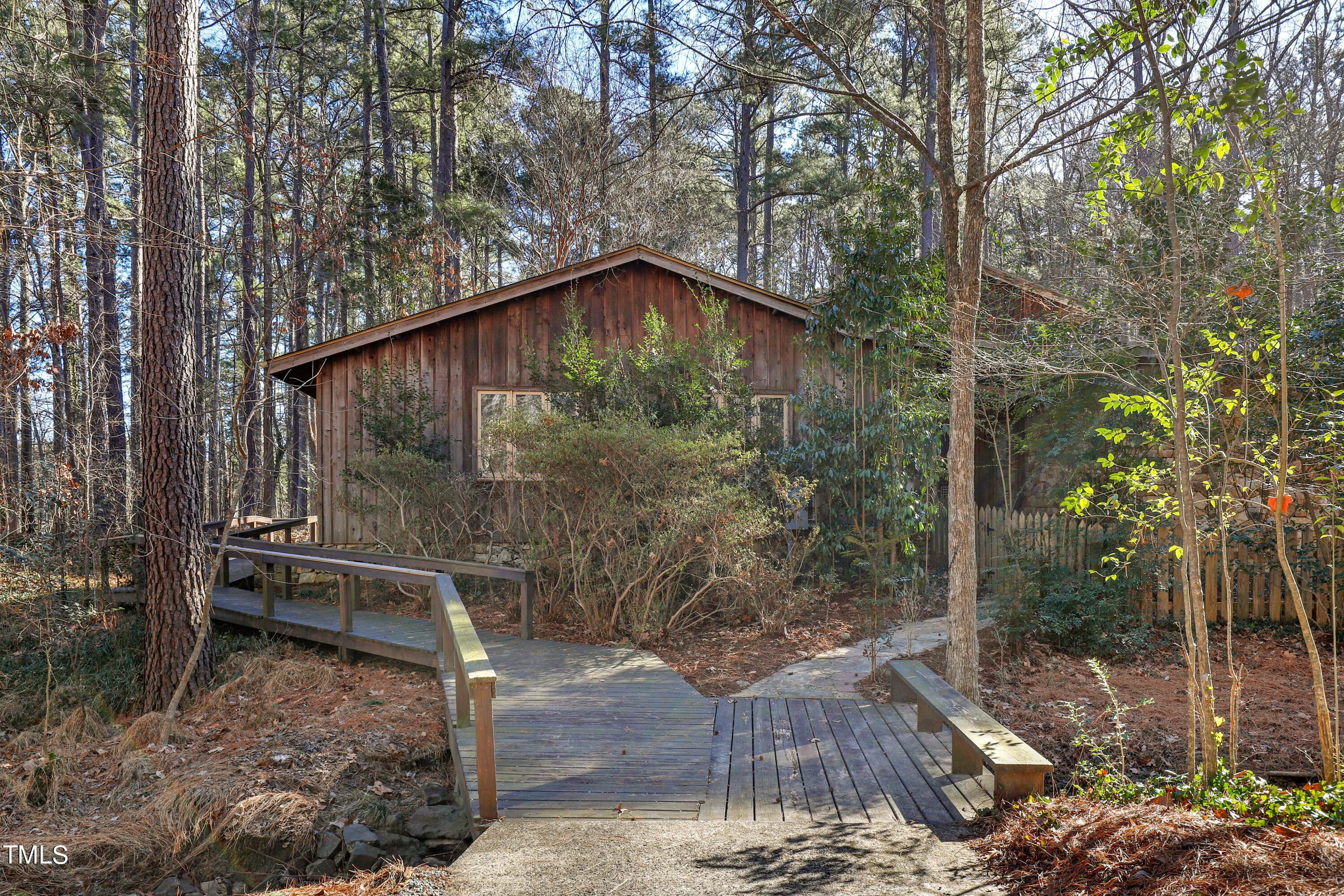 316 Clark Lake Road Durham, NC 27707 - Photo 61 of 65 a backyard of a house with table and chairs