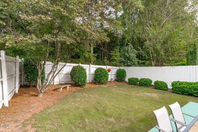a view of backyard with swimming pool