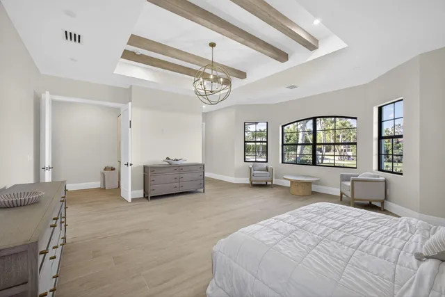 a view of a house with swimming pool and sitting area