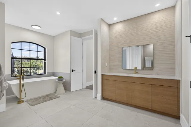 a bedroom with furniture and a wooden floor