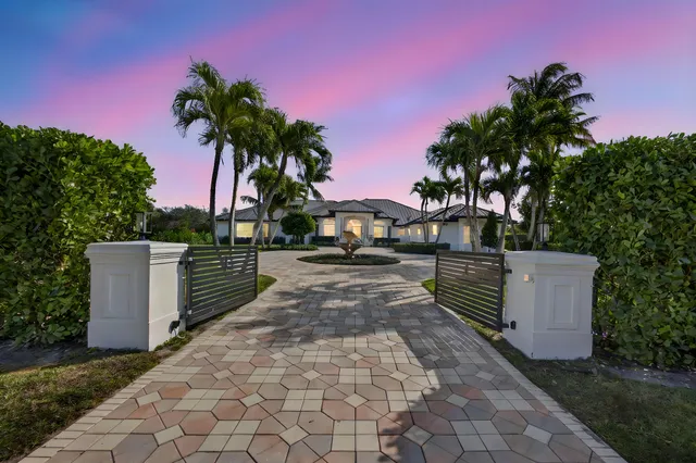 a living room with furniture and large windows