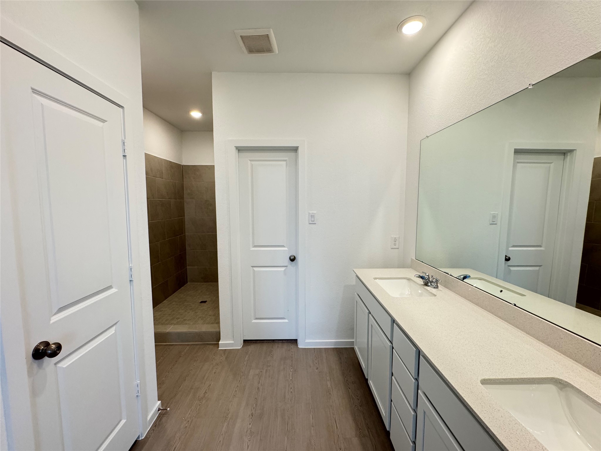 7819 Evening Emerald Drive Rosharon, TX 77583 - Photo 7 of 12 a bathroom with a double vanity sink and mirror