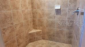650 Golden Gate Point, Unit 301 Sarasota, FL 34236 - Photo 20 of 31 a bathroom with a shower