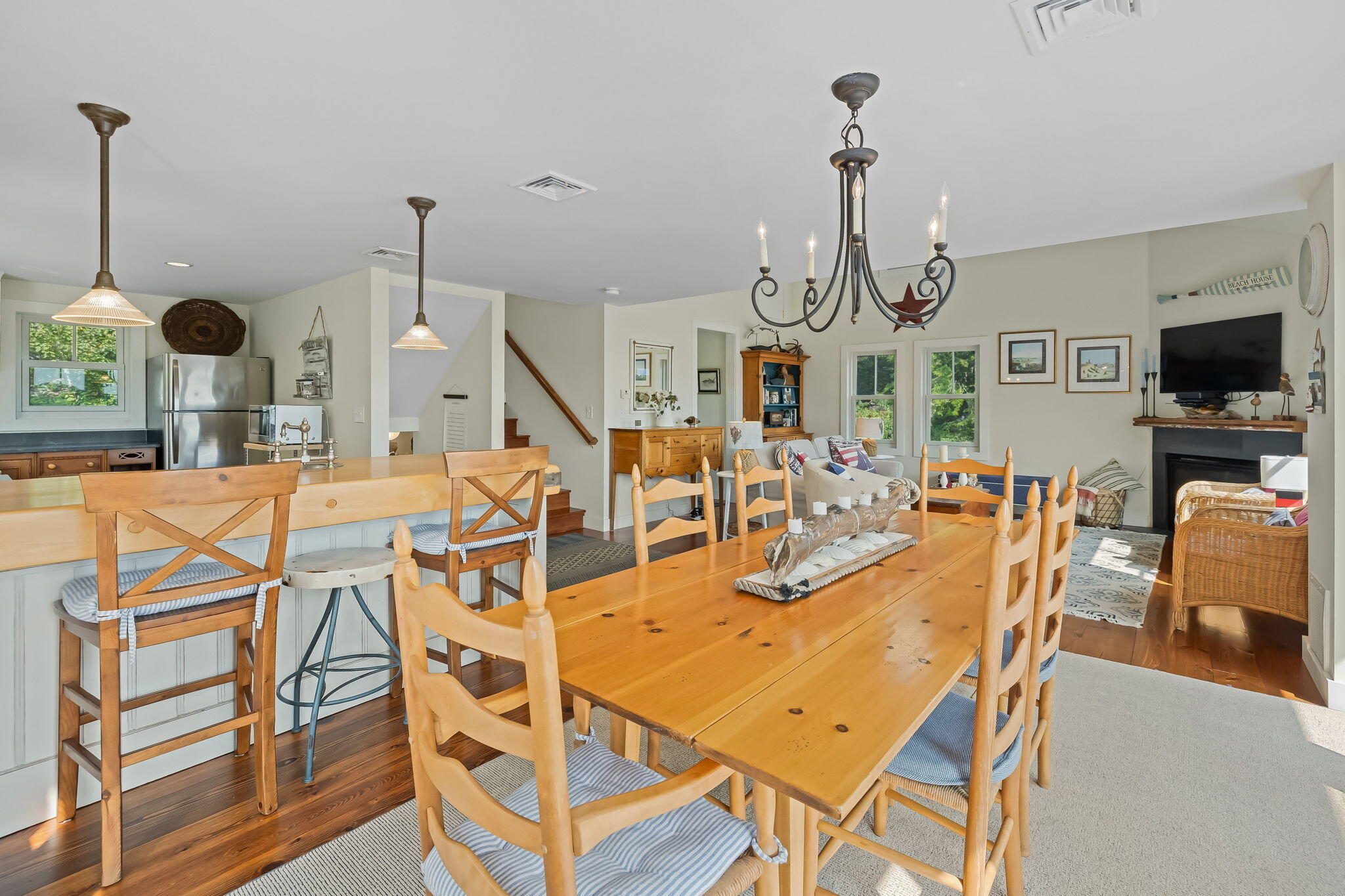 63 Briar Spring Road Orleans, MA 02653 - Photo 15 of 37 a view of a dining room with furniture window and wooden floor