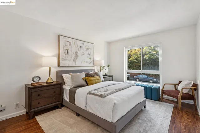 a bedroom with a bed and a couch