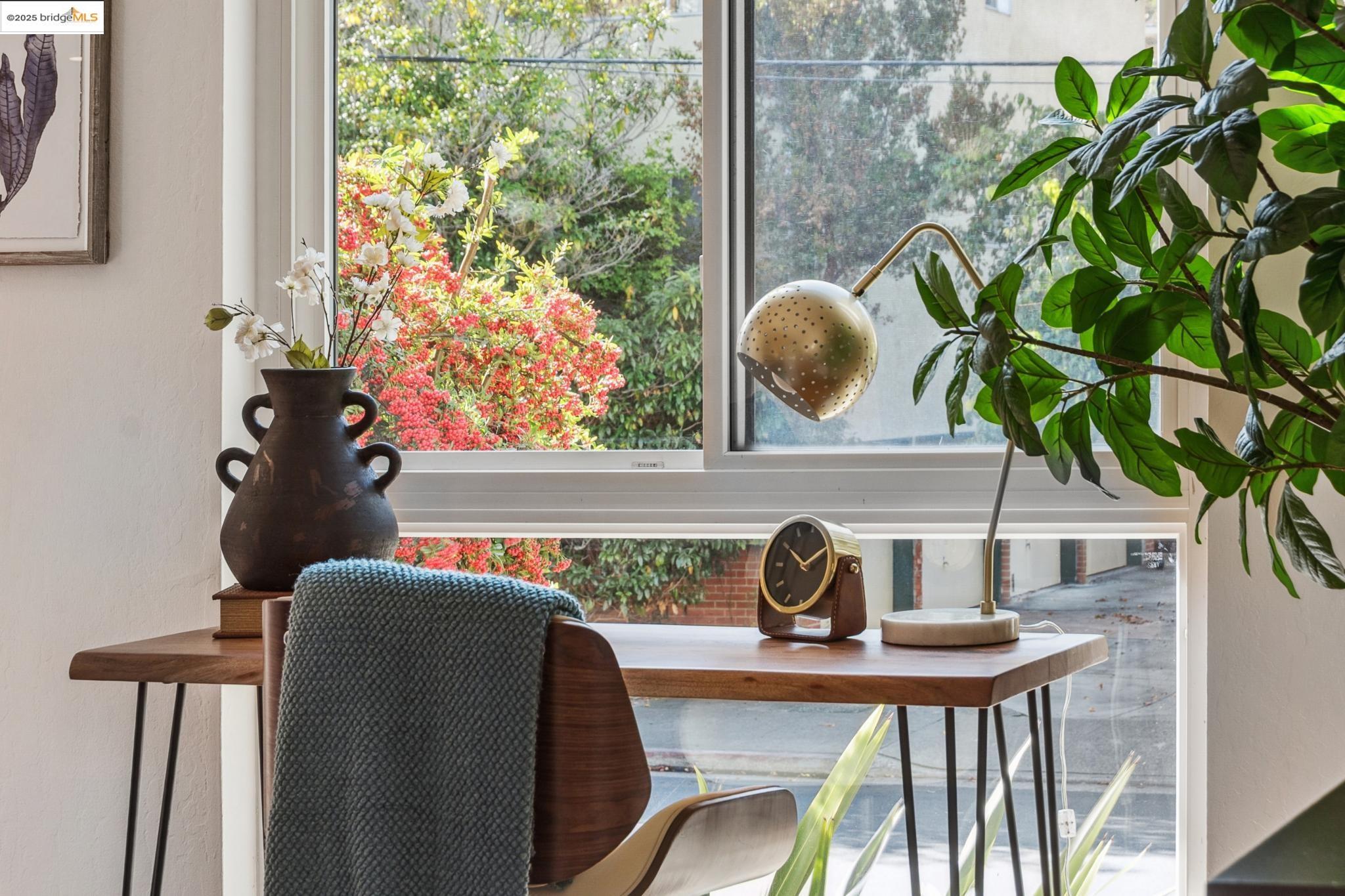 651 Oakland Avenue, Unit 1E Oakland, CA 94611 - Photo 20 of 28 a vase of flowers sitting on a table