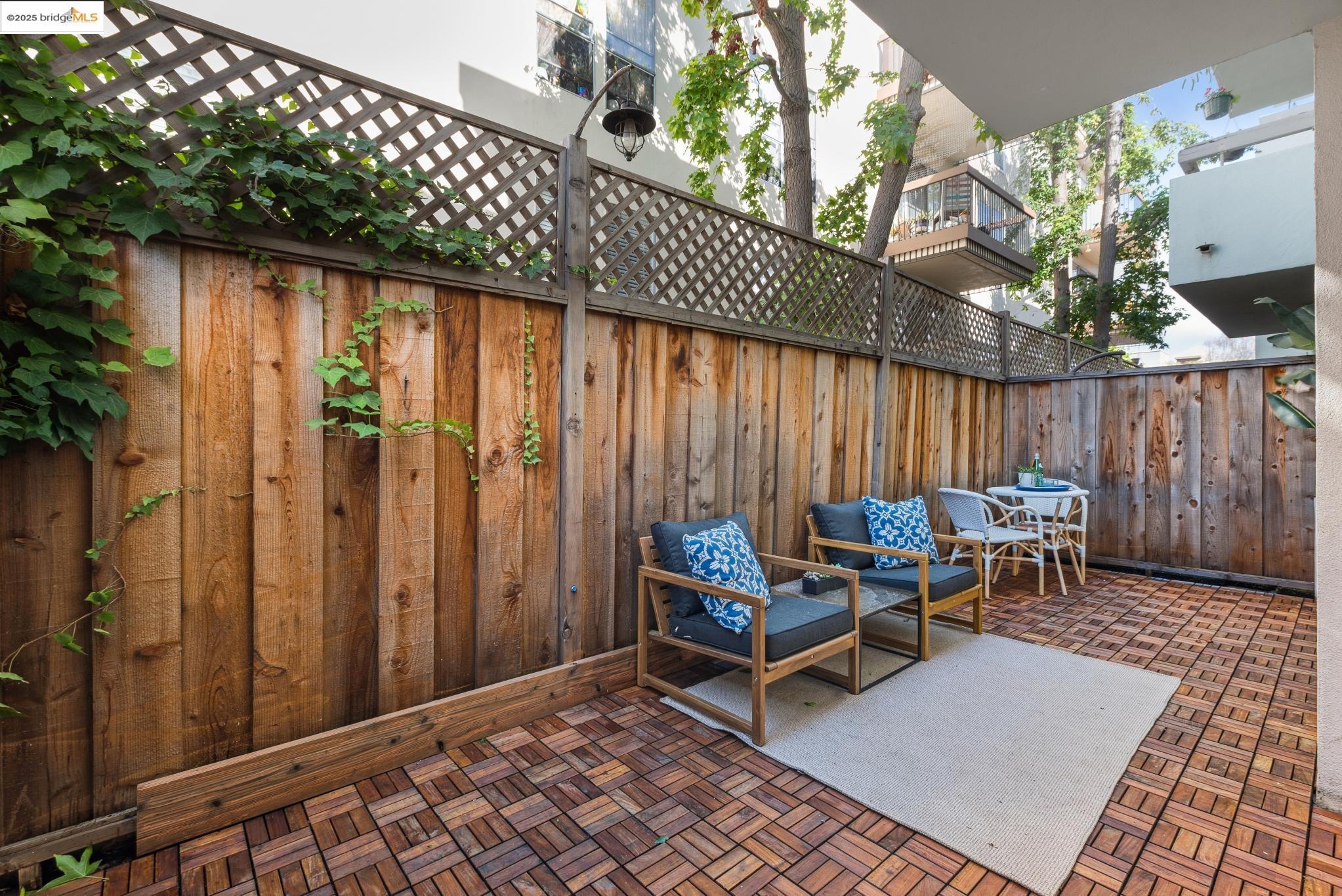 651 Oakland Avenue, Unit 1E Oakland, CA 94611 - Photo 21 of 28 a backyard of a house with outdoor seating